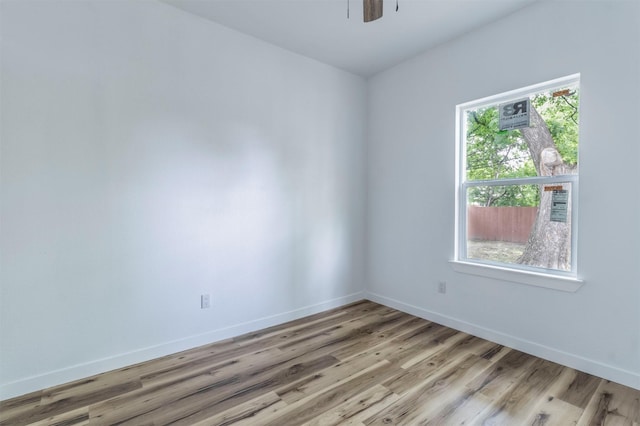 1014 Trinity St, Cleburne, TX 76031 - spare room with light wood-style flooring, baseboards, and ceiling fan