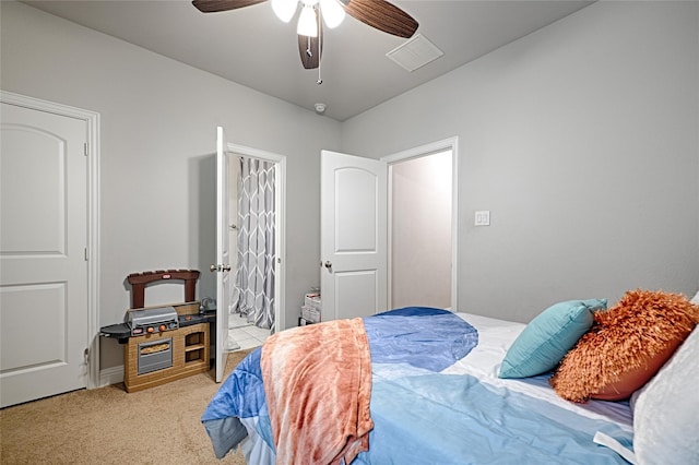 bedroom with ceiling fan, visible vents, and carpet floors