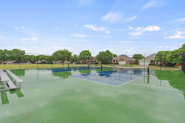view of sport court with fence