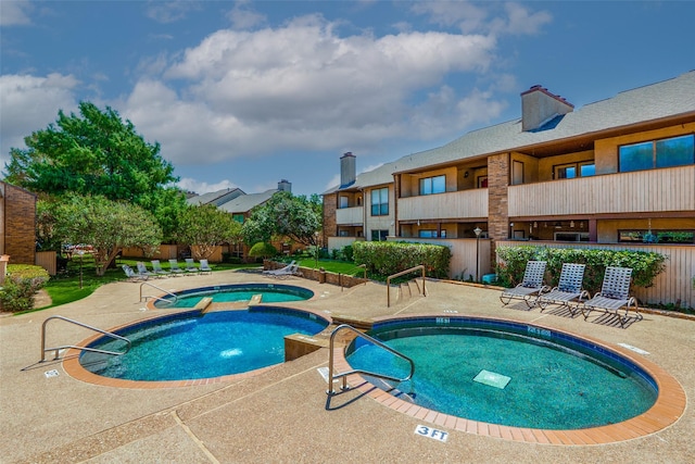 1200 Harwell Dr Unit 1924, Arlington, TX 76011 - view of swimming pool with a patio area and a pool with connected hot tub