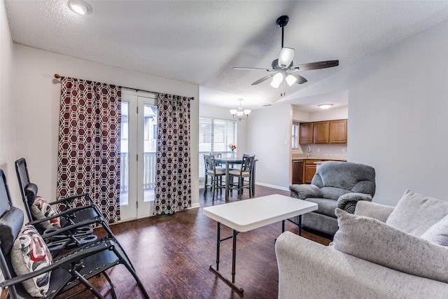 1200 Harwell Dr Unit 1924, Arlington, TX 76011 - living room with dark wood-style flooring, a ceiling fan, a chandelier, baseboards, and a textured ceiling