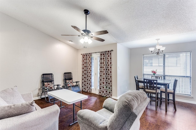 1200 Harwell Dr Unit 1924, Arlington, TX 76011 - living room with a chandelier, baseboards, ceiling fan, a textured ceiling, and dark wood-style floors