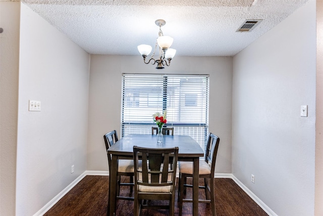 1200 Harwell Dr Unit 1924, Arlington, TX 76011 - dining area with wood finished floors, a chandelier, baseboards, and a textured ceiling