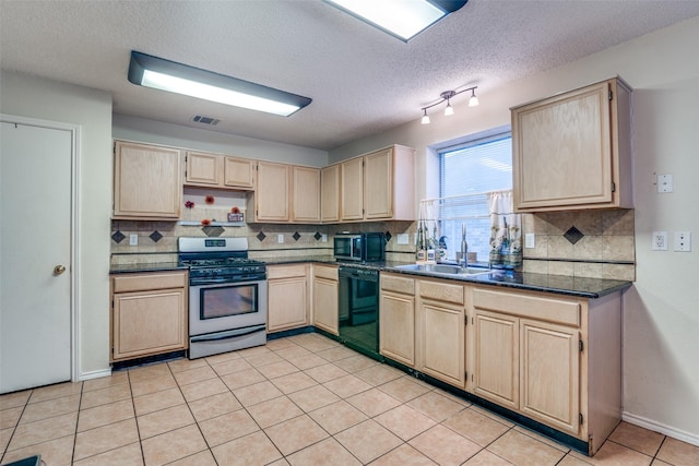 6109 Sasaki Way, Garland, TX 75043 - kitchen with appliances with stainless steel finishes, light brown cabinets, a sink, dark countertops, and decorative backsplash