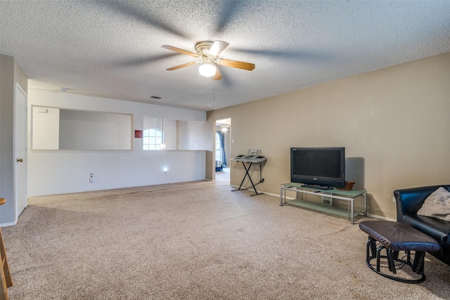 6109 Sasaki Way, Garland, TX 75043 - living area featuring ceiling fan, carpet, and a textured ceiling