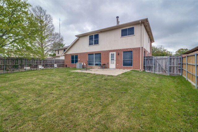 6109 Sasaki Way, Garland, TX 75043 - rear view of property with brick siding, central AC unit, a patio, and a gate