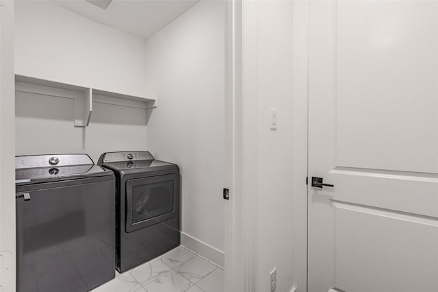 3509 Mescalbean Dr, Mckinney, TX 75071 - laundry area featuring baseboards, marble finish floor, washing machine and dryer, and laundry area