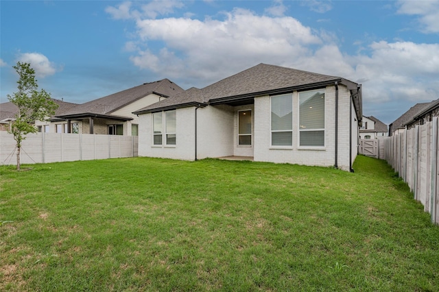 3509 Mescalbean Dr, Mckinney, TX 75071 - back of house with a lawn, brick siding, and a fenced backyard
