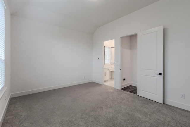 3509 Mescalbean Dr, Mckinney, TX 75071 - unfurnished bedroom featuring ensuite bath, lofted ceiling, carpet, and baseboards