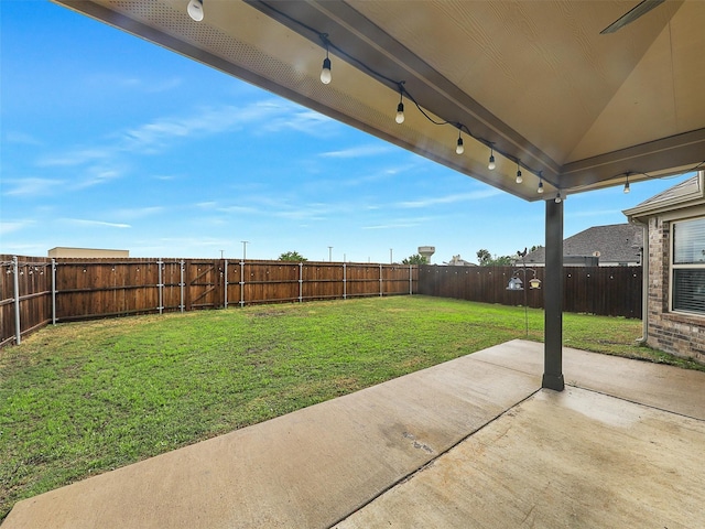 view of yard with a patio area and a fenced backyard