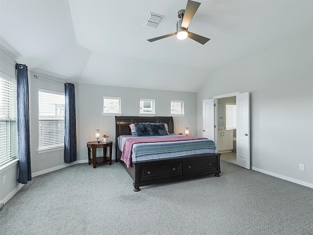 bedroom featuring vaulted ceiling, multiple windows, visible vents, and carpet floors