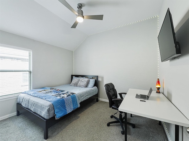 carpeted bedroom with baseboards, a ceiling fan, and vaulted ceiling
