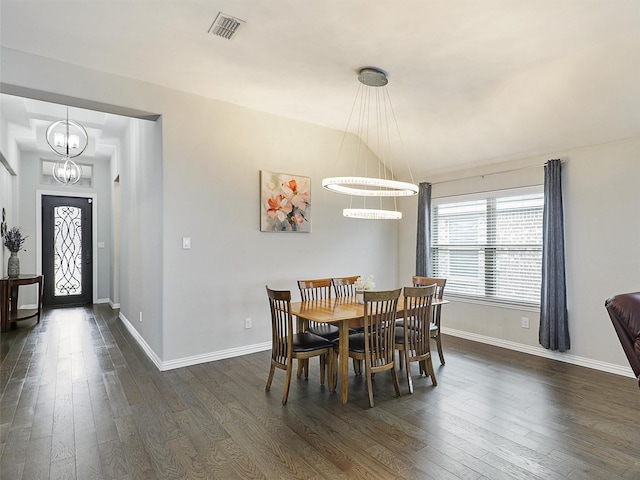 dining area with baseboards, dark wood-style floors, and visible vents