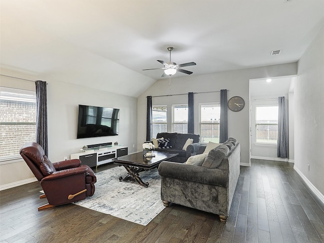 living room featuring baseboards, visible vents, plenty of natural light, and dark wood-type flooring