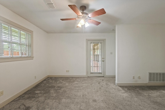 2020 Sauls Ln, Denton, TX 76209 - empty room with ceiling fan, carpet flooring, baseboards, and visible vents