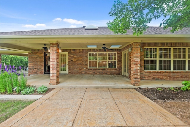 2020 Sauls Ln, Denton, TX 76209 - exterior space with brick siding, roof with shingles, a patio area, and ceiling fan