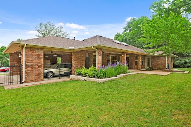 2020 Sauls Ln, Denton, TX 76209 - back of property with a patio, fence, a lawn, ceiling fan, and brick siding