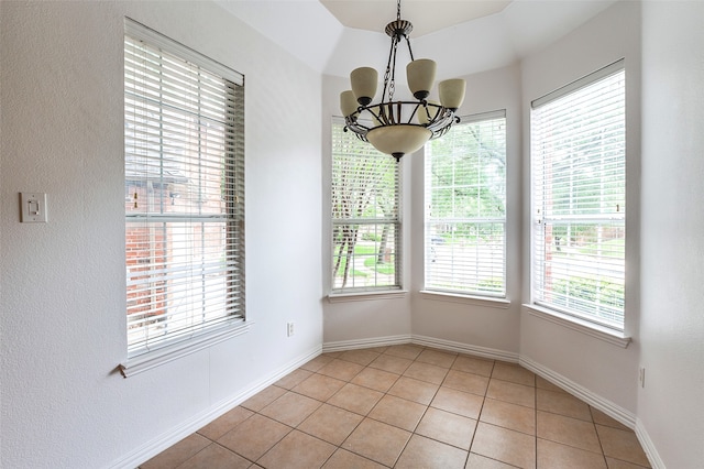 5204 Stoney Trl, Mckinney, TX 75072 - unfurnished dining area featuring light tile patterned floors, baseboards, a healthy amount of sunlight, and an inviting chandelier