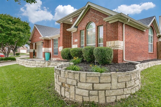 7916 Stansfield Dr, Fort Worth, TX 76137 - exterior space featuring a shingled roof, brick siding, and a front lawn