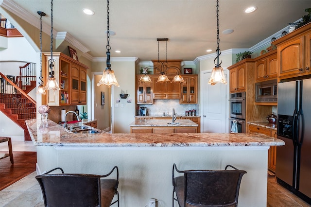 kitchen featuring a sink, stainless steel appliances, ornamental molding, recessed lighting, and decorative backsplash
