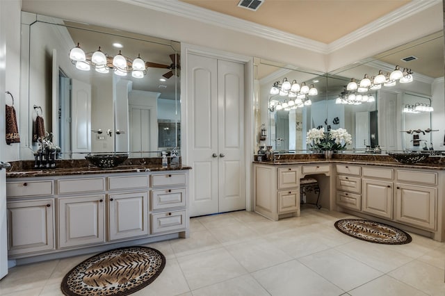 bathroom featuring tile patterned floors, vanity, crown molding, and visible vents