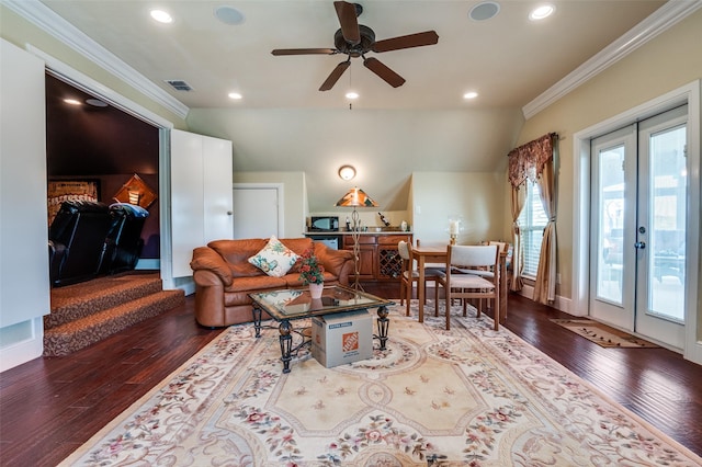 living area with hardwood / wood-style floors, french doors, ornamental molding, visible vents, and a ceiling fan