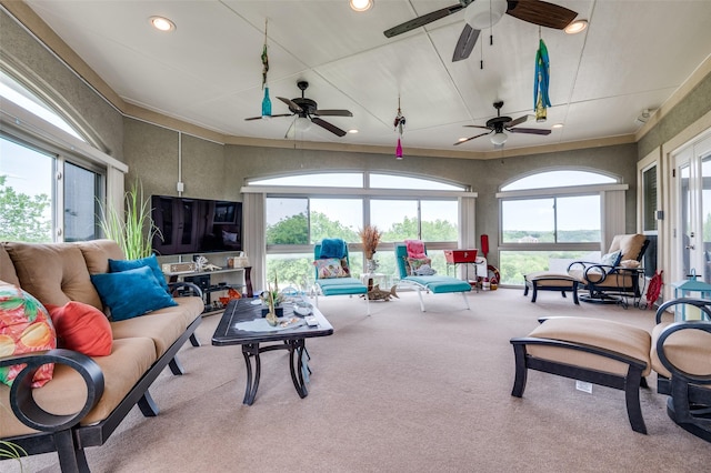 carpeted living room with ceiling fan and recessed lighting