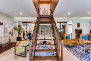 staircase featuring recessed lighting