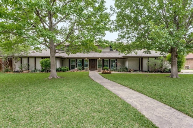 ranch-style house with a front yard