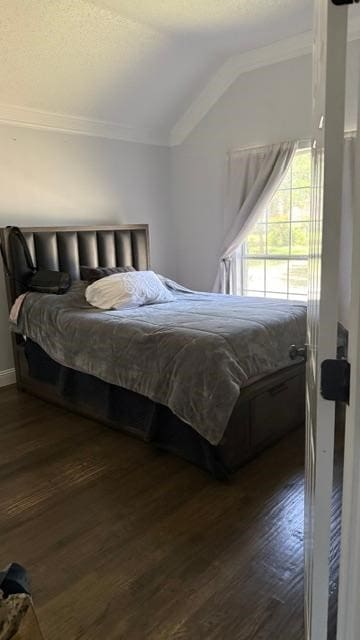 1512 Chester Dr, Plano, TX 75025 - bedroom with ornamental molding, dark wood-style flooring, and vaulted ceiling