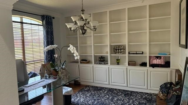 1512 Chester Dr, Plano, TX 75025 - mudroom featuring a chandelier, ornamental molding, dark wood finished floors, and built in features