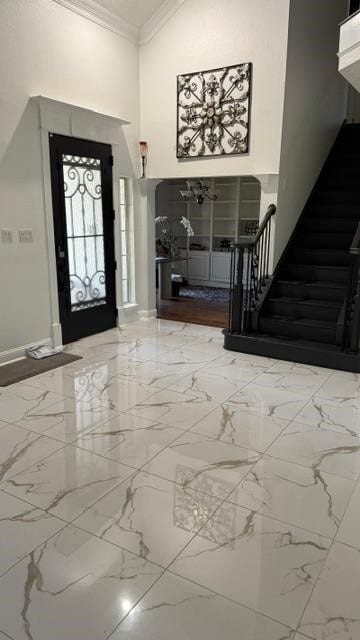 1512 Chester Dr, Plano, TX 75025 - entrance foyer featuring a towering ceiling, marble finish flooring, stairs, crown molding, and baseboards