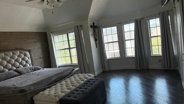 1512 Chester Dr, Plano, TX 75025 - bedroom featuring vaulted ceiling, baseboards, wood finished floors, a textured ceiling, and ceiling fan
