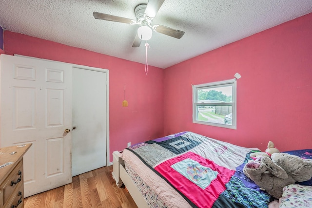 1941 Michael Ct, Pelican Bay, TX 76020 - bedroom with ceiling fan, light wood-style flooring, and a textured ceiling