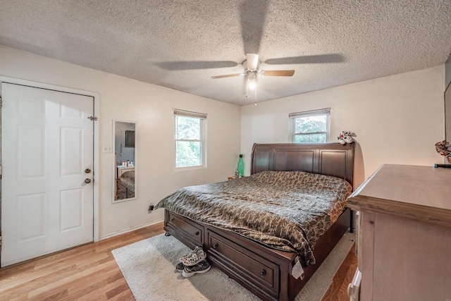 1941 Michael Ct, Pelican Bay, TX 76020 - bedroom with a textured ceiling, light wood-style flooring, and ceiling fan