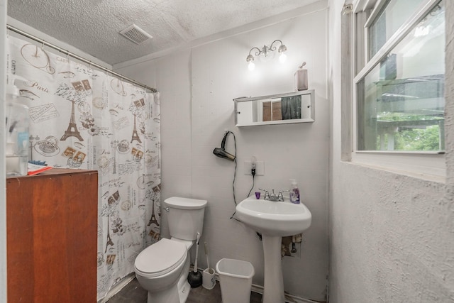 1941 Michael Ct, Pelican Bay, TX 76020 - bathroom featuring toilet, visible vents, a textured ceiling, and a shower with shower curtain