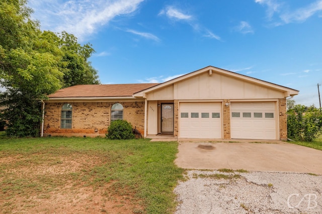 3749 Oldham Ln, Abilene, TX 79602 - single story home featuring concrete driveway, a front lawn, brick siding, and a garage