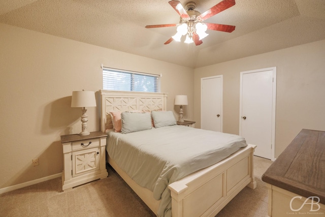 3749 Oldham Ln, Abilene, TX 79602 - bedroom with baseboards, a textured ceiling, light carpet, and a ceiling fan