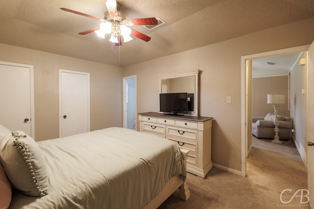 3749 Oldham Ln, Abilene, TX 79602 - bedroom featuring light colored carpet, visible vents, baseboards, and ceiling fan