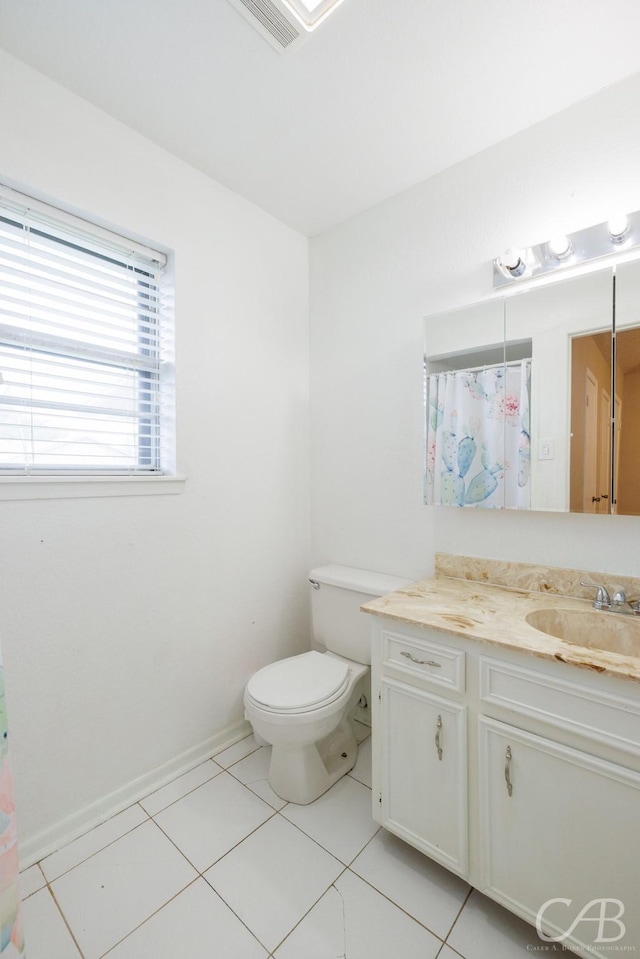 3749 Oldham Ln, Abilene, TX 79602 - bathroom featuring vanity, toilet, visible vents, and tile patterned flooring