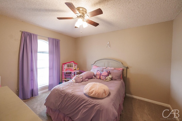3749 Oldham Ln, Abilene, TX 79602 - bedroom featuring baseboards, carpet flooring, ceiling fan, and a textured ceiling