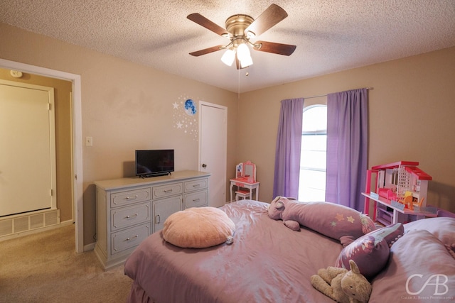 3749 Oldham Ln, Abilene, TX 79602 - bedroom with ceiling fan, light carpet, visible vents, and a textured ceiling