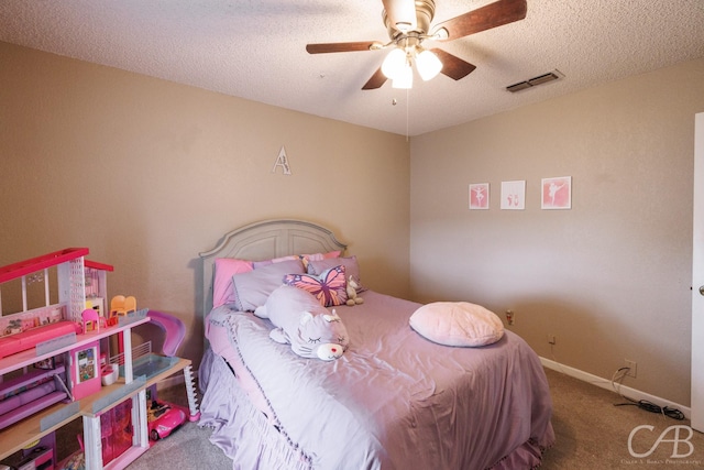 3749 Oldham Ln, Abilene, TX 79602 - carpeted bedroom with a textured ceiling, baseboards, a ceiling fan, and visible vents