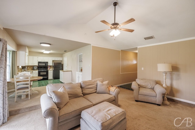 3749 Oldham Ln, Abilene, TX 79602 - living room with vaulted ceiling, visible vents, ceiling fan, and light carpet
