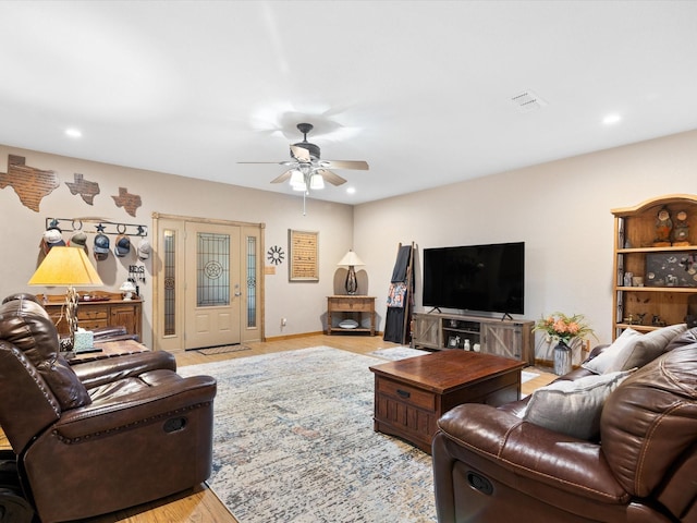 living area featuring light wood-type flooring, visible vents, ceiling fan, and recessed lighting