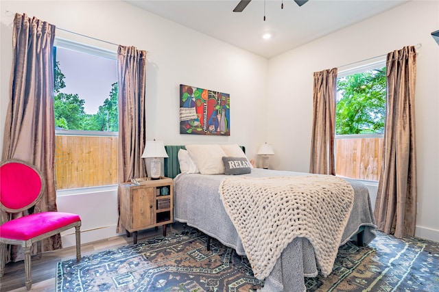 bedroom featuring a ceiling fan, recessed lighting, and wood finished floors