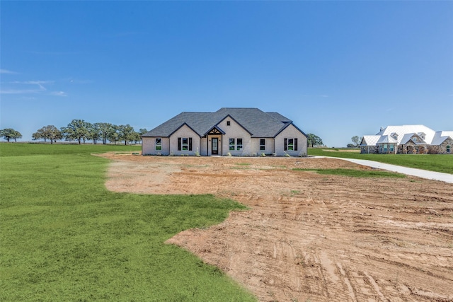 modern farmhouse with a front lawn