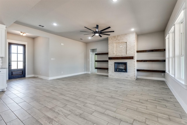 unfurnished living room with ceiling fan, baseboards, visible vents, and recessed lighting