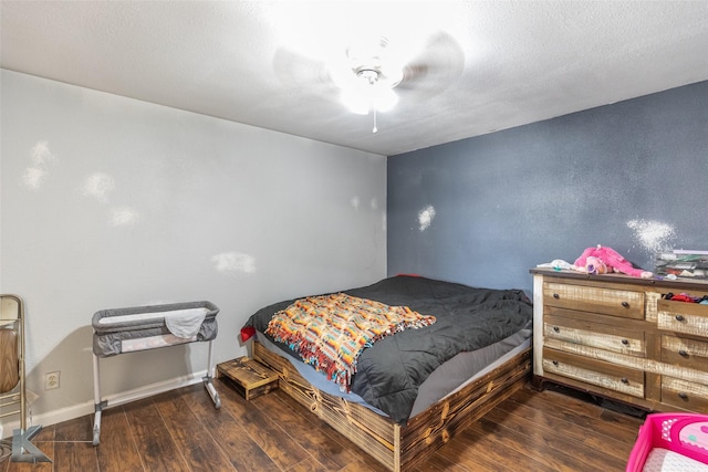bedroom with wood finished floors and ceiling fan