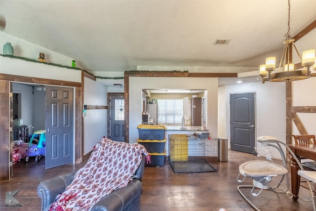 living room featuring a chandelier and wood finished floors
